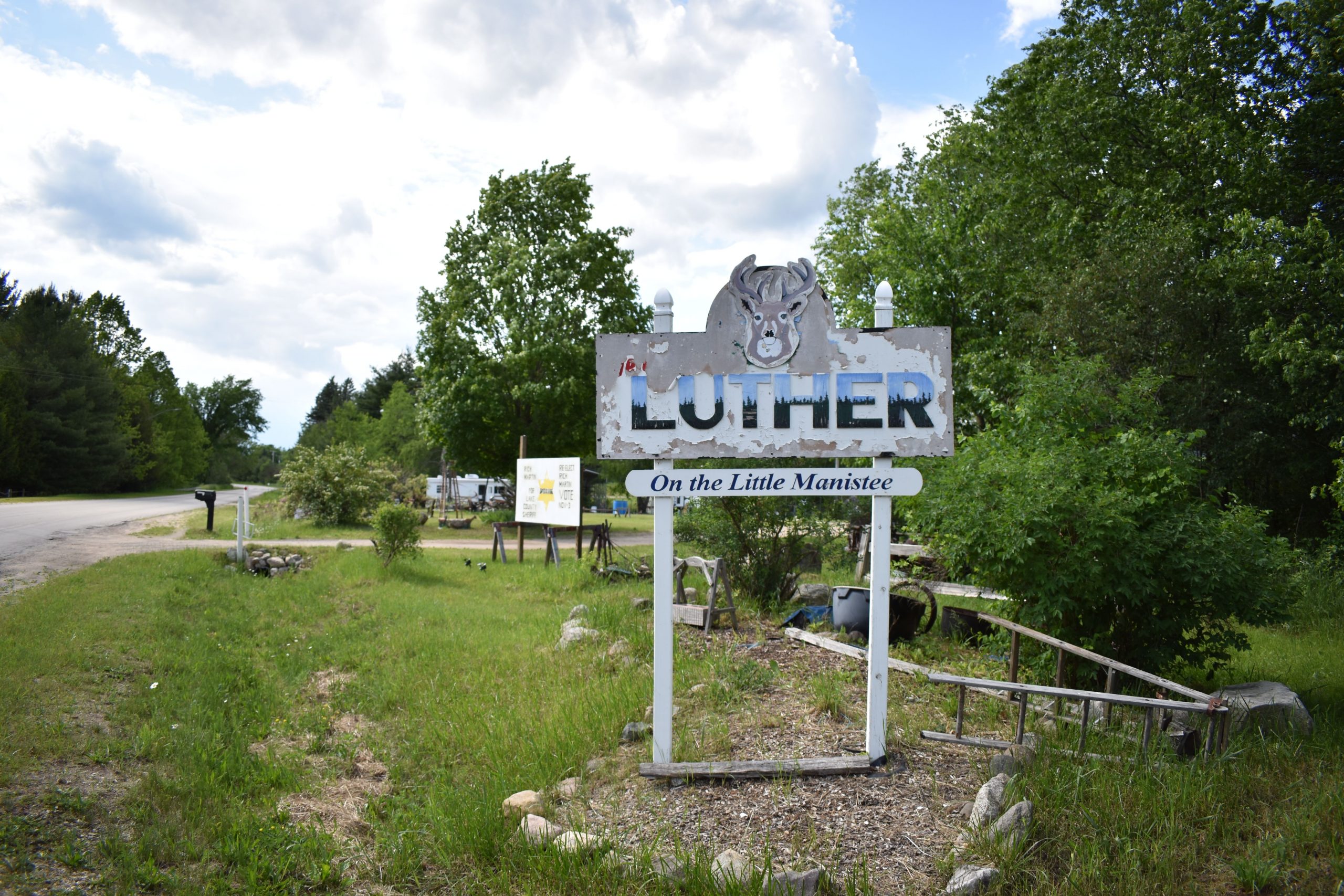 Photo of sign reading: "Luther: On the Little Manistee"