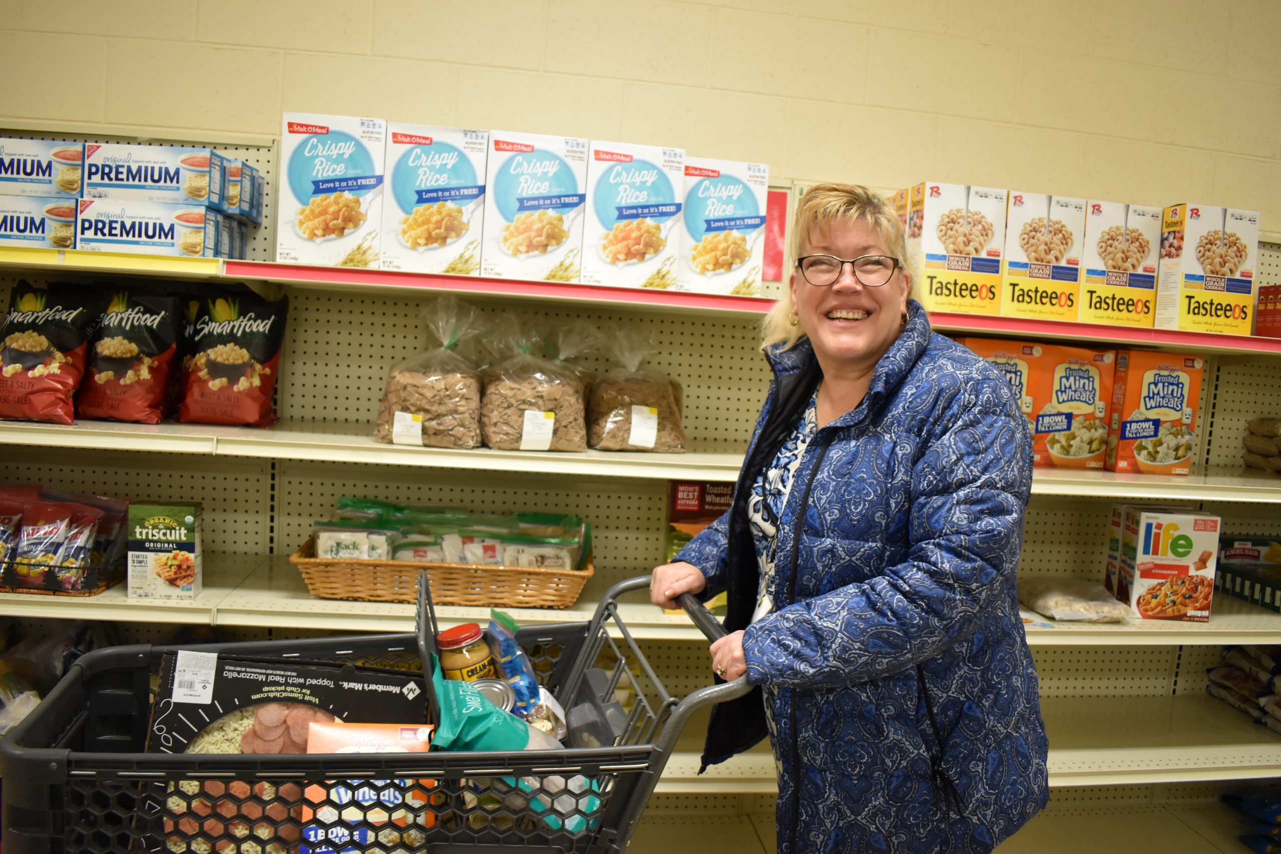 Deb shops for food at the pantry