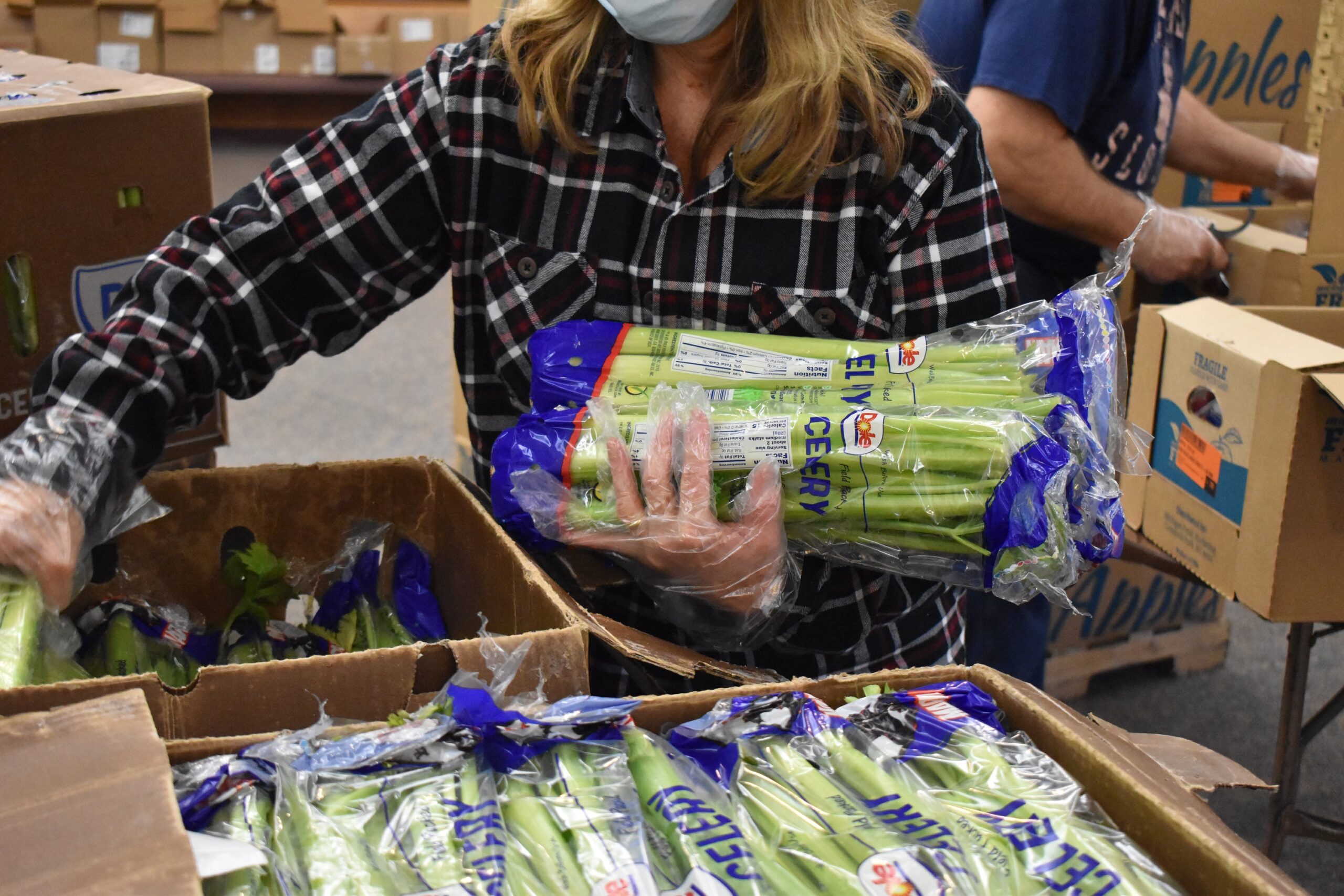 woman holding celery