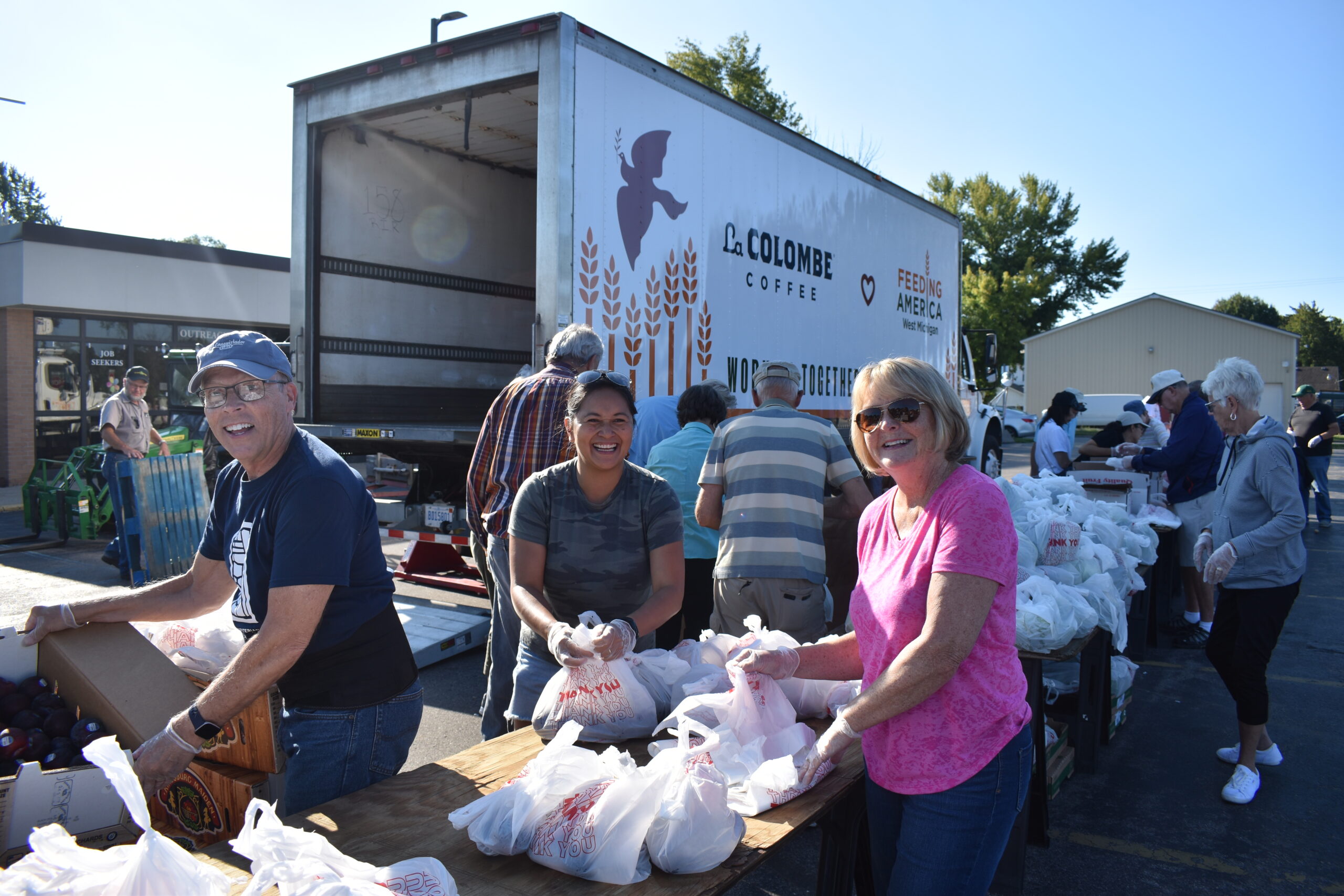 volunteers in front of LaColombe truck at a Mobile Pantry